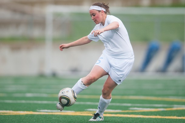 Skyline's Carmen Flesher kids the ball up field during the first half of their game against Huron, Thursday May 23.
Courtney Sacco I AnnArbor.com 